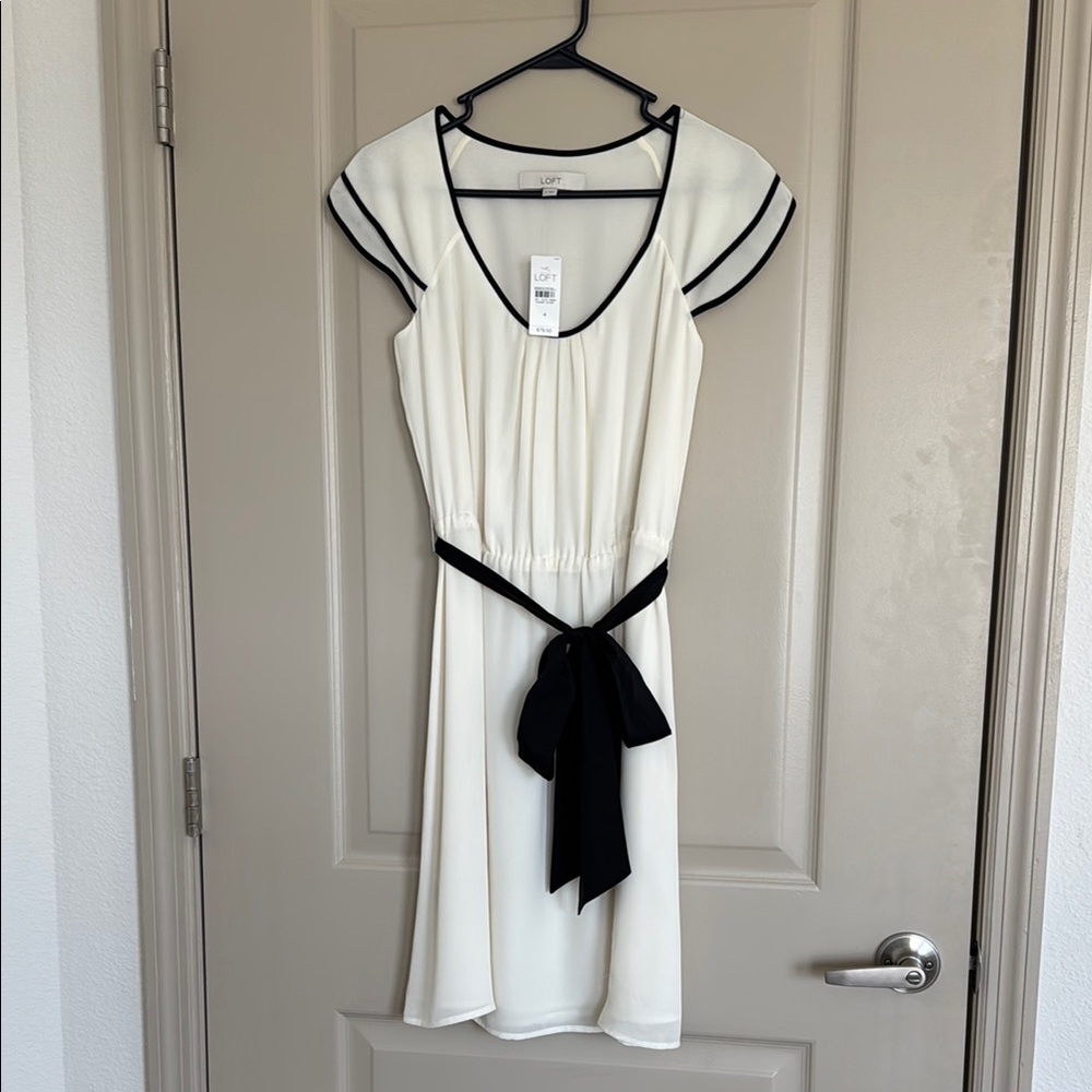 Elegant Cream Dress with Black Accents